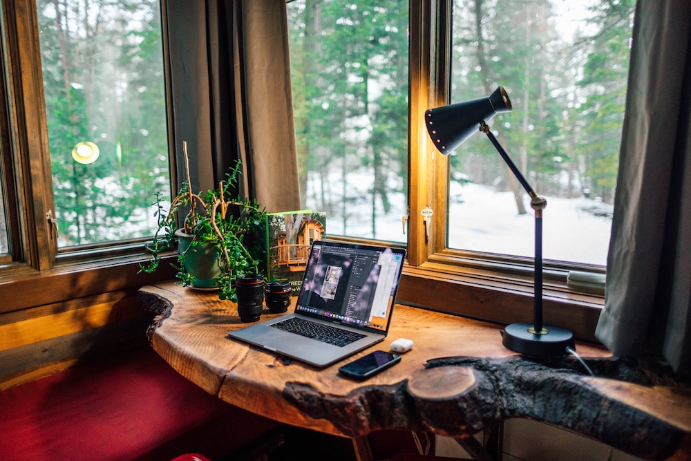 work from home desk in the forest view of trees